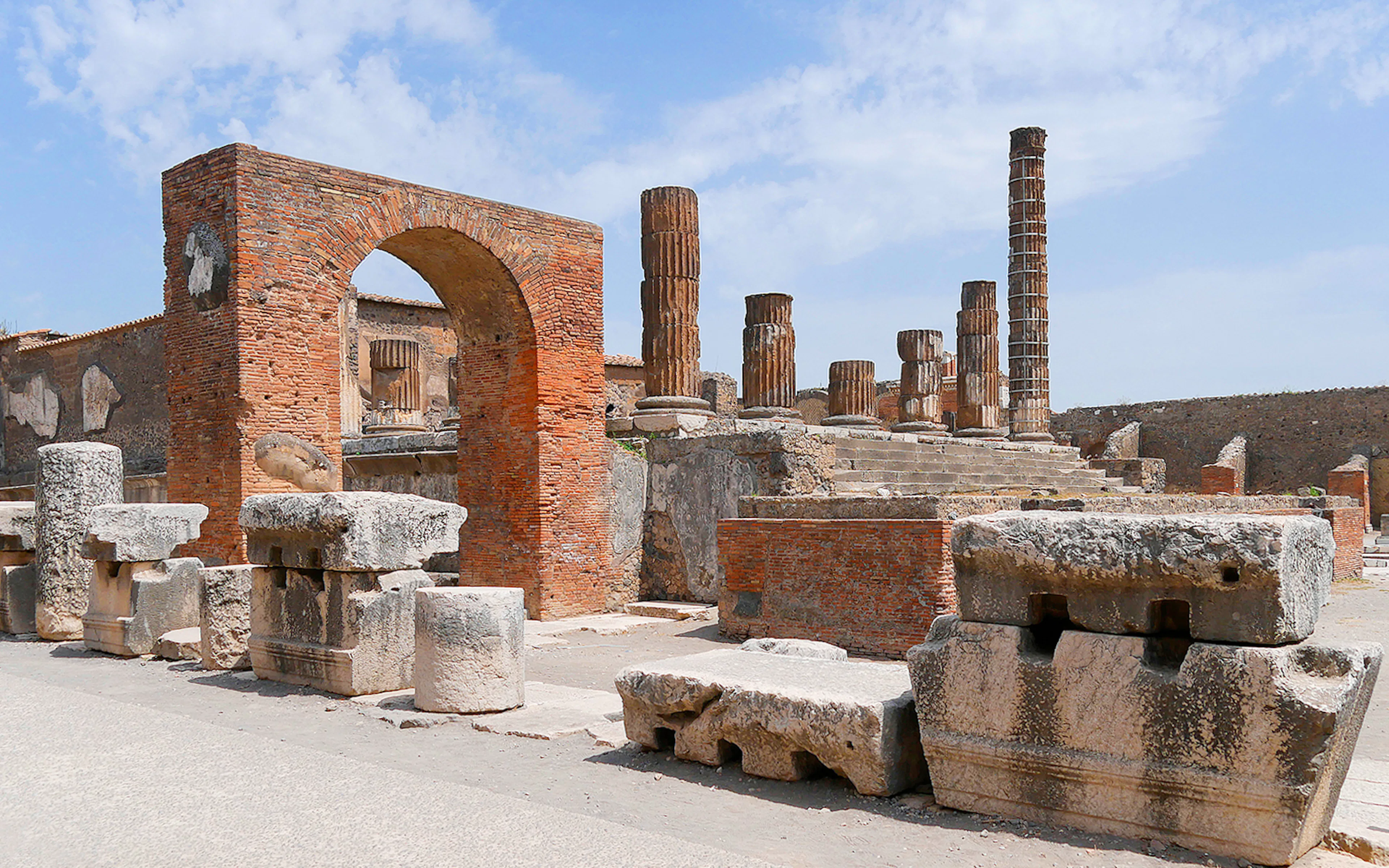 Ancient ruins and columns at Pompeii Forum, Italy.