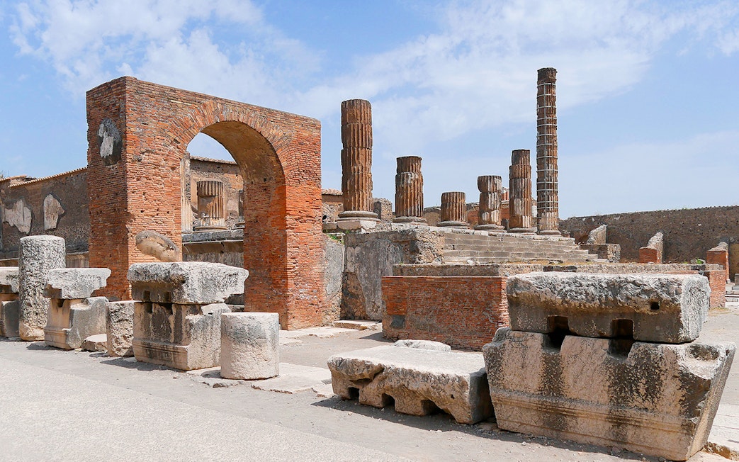 Ancient ruins and columns at Pompeii Forum, Italy.