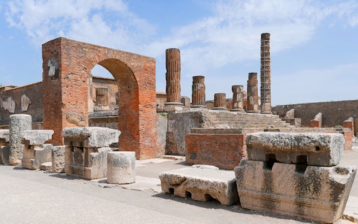 Ancient ruins and columns at Pompeii Forum, Italy.