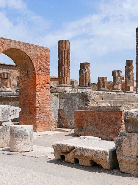Ancient ruins and columns at Pompeii Forum, Italy.