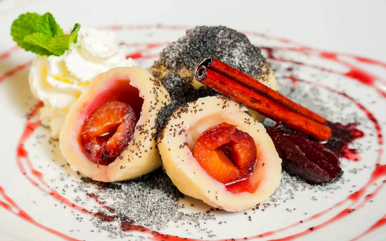 Czech plum dumplings with poppy seeds and cinnamon at Slivovitz Museum, Prague.