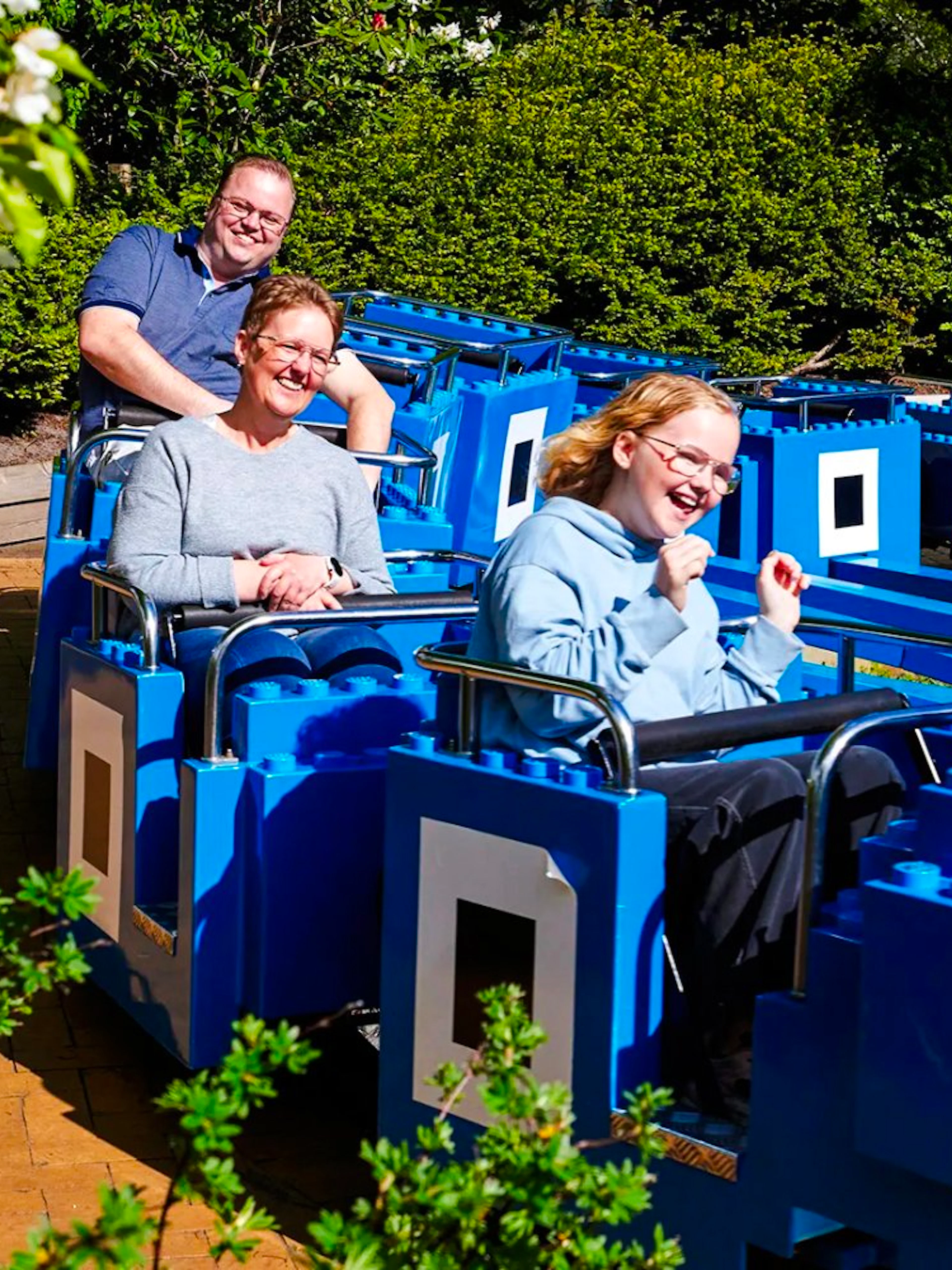 Guests on a LEGO-themed ride at LEGOLAND Billund.