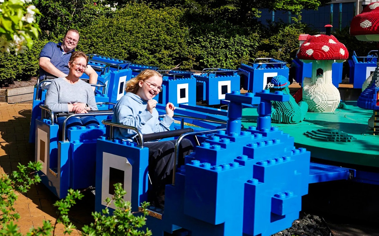 Guests on a LEGO-themed ride at LEGOLAND Billund.