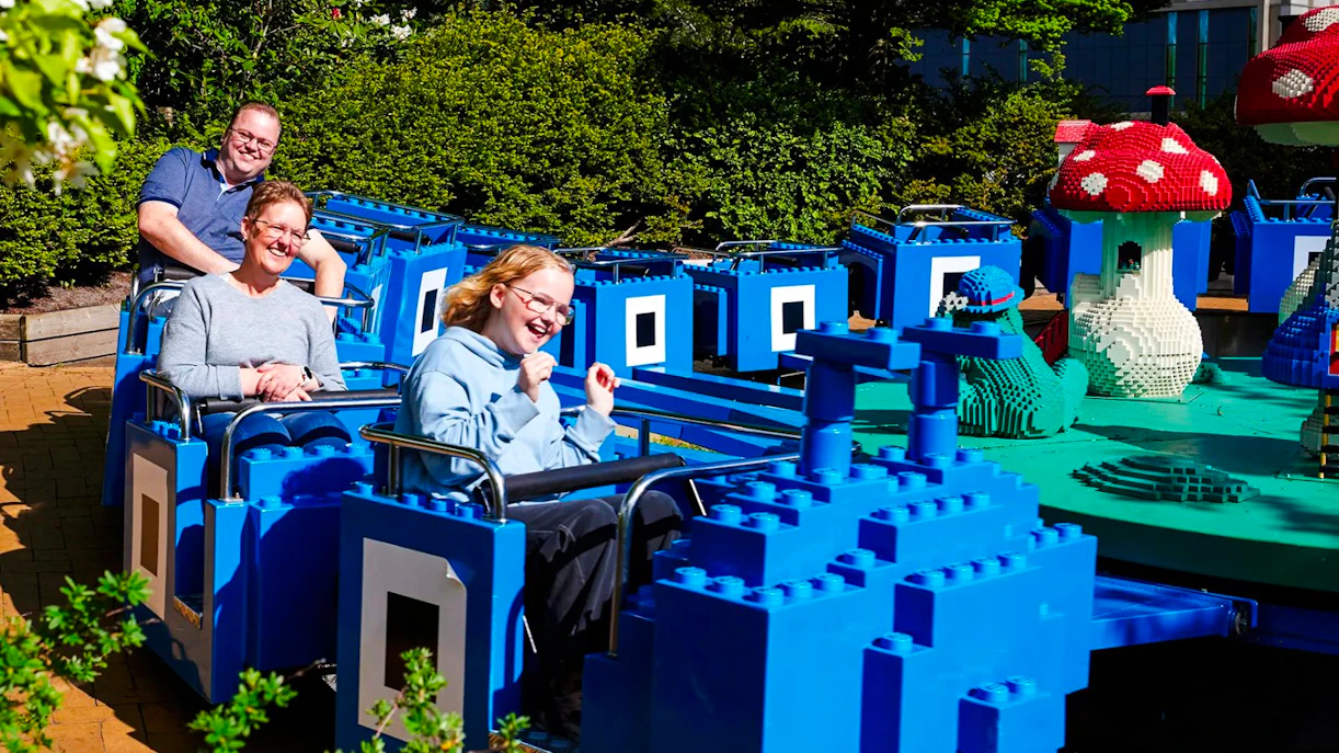 Guests on a LEGO-themed ride at LEGOLAND Billund.