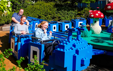 Guests on a LEGO-themed ride at LEGOLAND Billund.