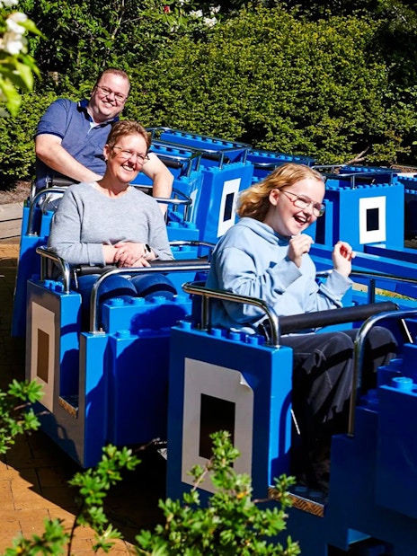 Guests on a LEGO-themed ride at LEGOLAND Billund.
