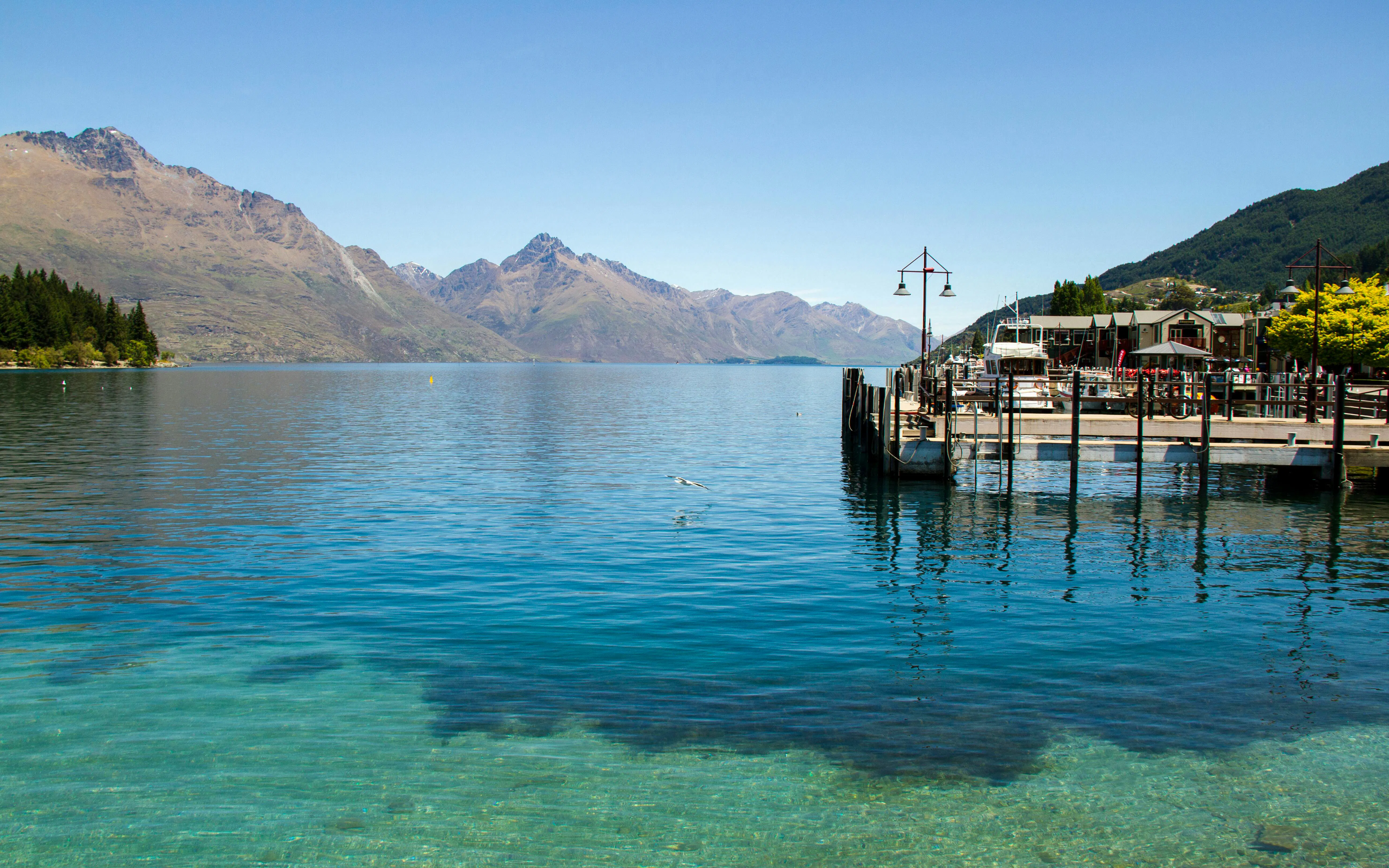 Steamer Wharf at Lake Wakatipu with mountains in Queenstown, New Zealand.