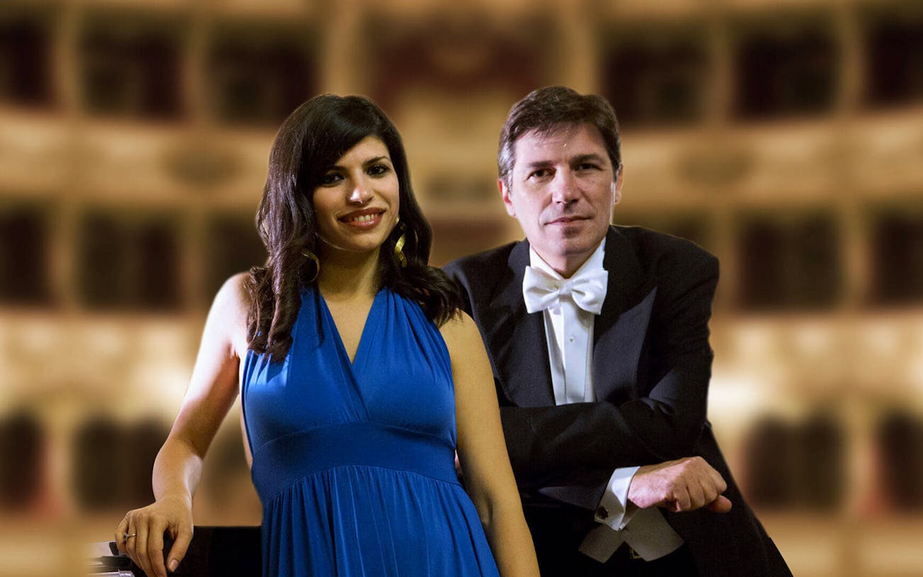Opera singers in formal attire at a concert venue for Opera's Greatest Hits & Romantic Piano Concert.