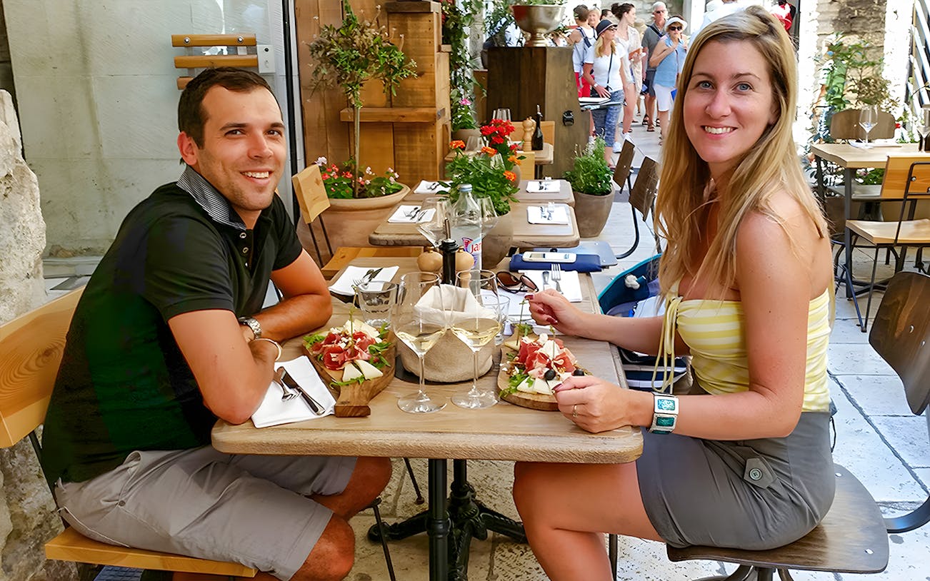 Wine tasting at an outdoor café in Diocletian's Palace, Split, with charcuterie.