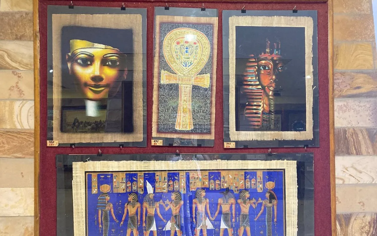 Ancient Egyptian papyrus art display in Hurghada shop.