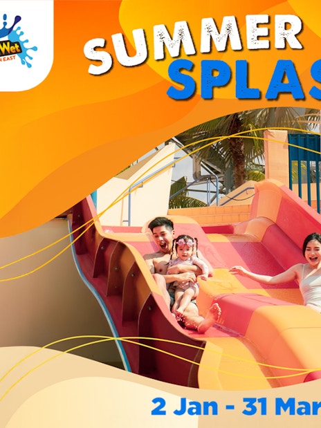 Family enjoying water slide at Wild Wild Wet, Singapore's Summer Wave Splash event.