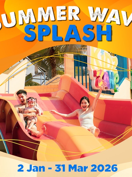 Family enjoying water slide at Wild Wild Wet, Singapore's Summer Wave Splash event.