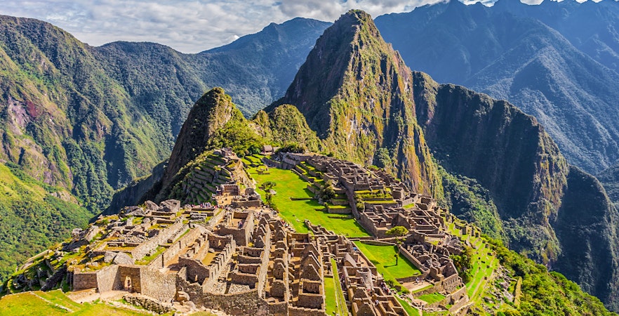Machu Picchu ruins with Huayna Picchu mountain in the background, Peru.