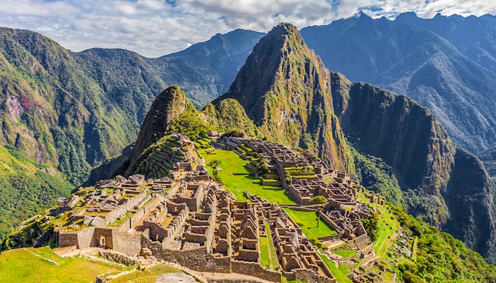Machu Picchu ruins with Huayna Picchu mountain in the background, Peru.