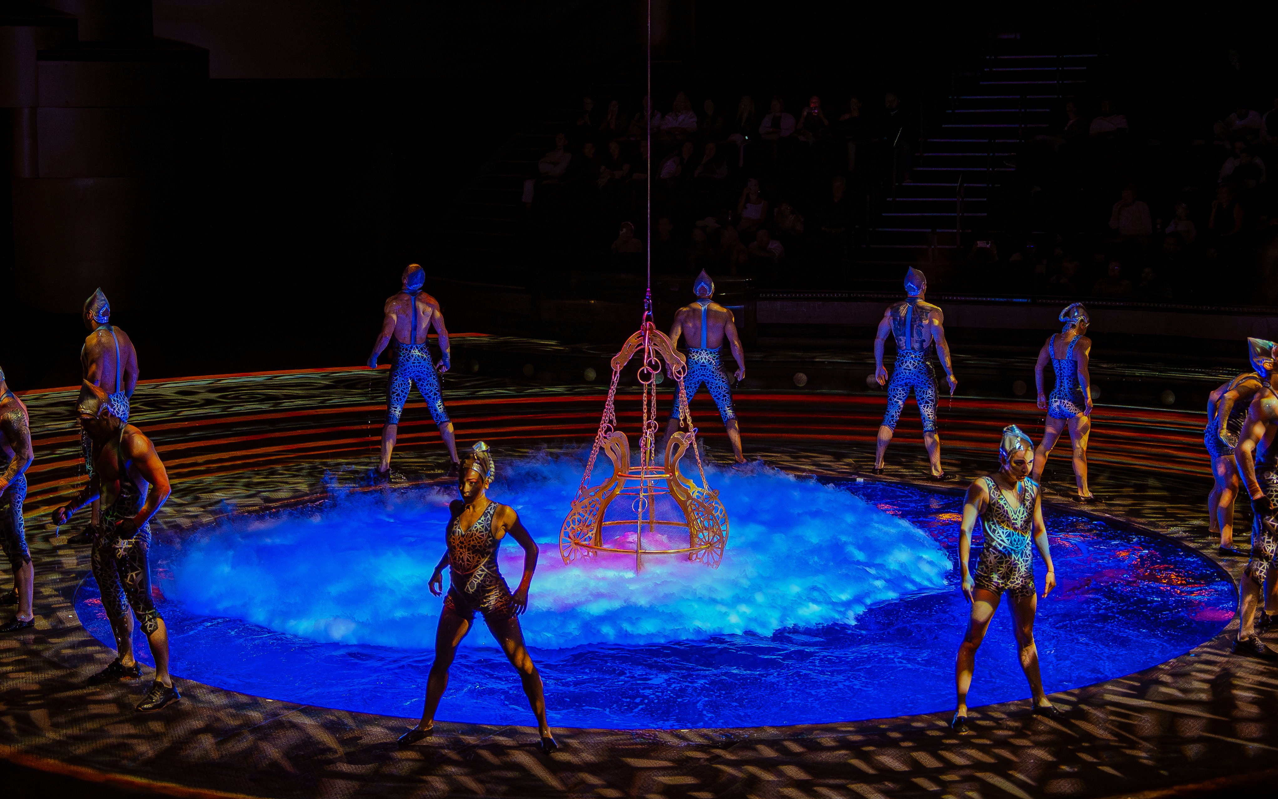 Acrobats performing around a water stage at La Perle show in Dubai.