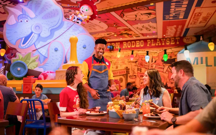 Guests dining at a themed restaurant in Walt Disney Resort Orlando.