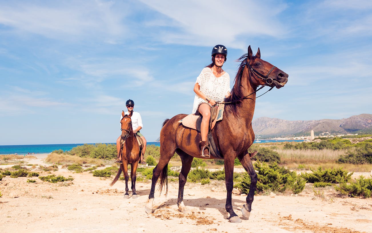 Horseback riders on a scenic trail near the coast in Antalya, Turkey.