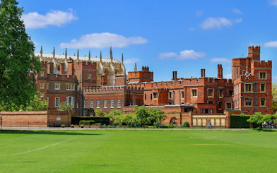Windsor Castle exterior with green lawn, part of London day trip tour.