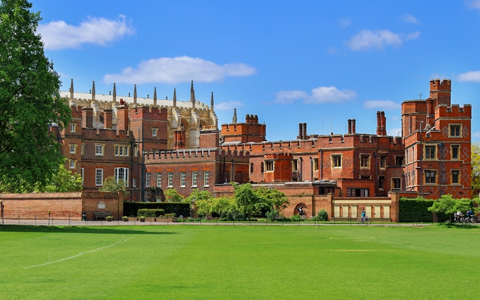Windsor Castle exterior with green lawn, part of London day trip tour.