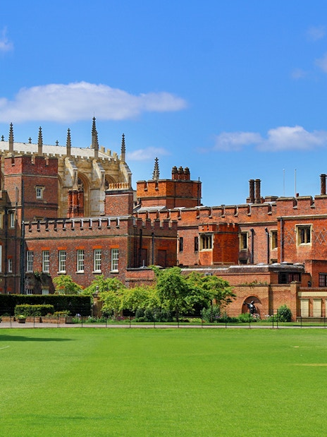 Windsor Castle exterior with green lawn, part of London day trip tour.