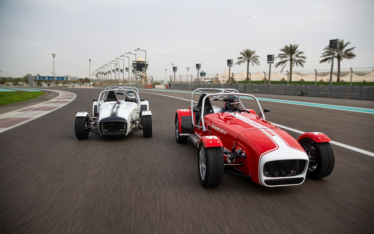 Caterham Seven 360 cars racing on Yas Marina Circuit track.