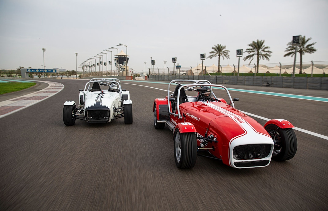 Caterham Seven 360 cars racing on Yas Marina Circuit track.