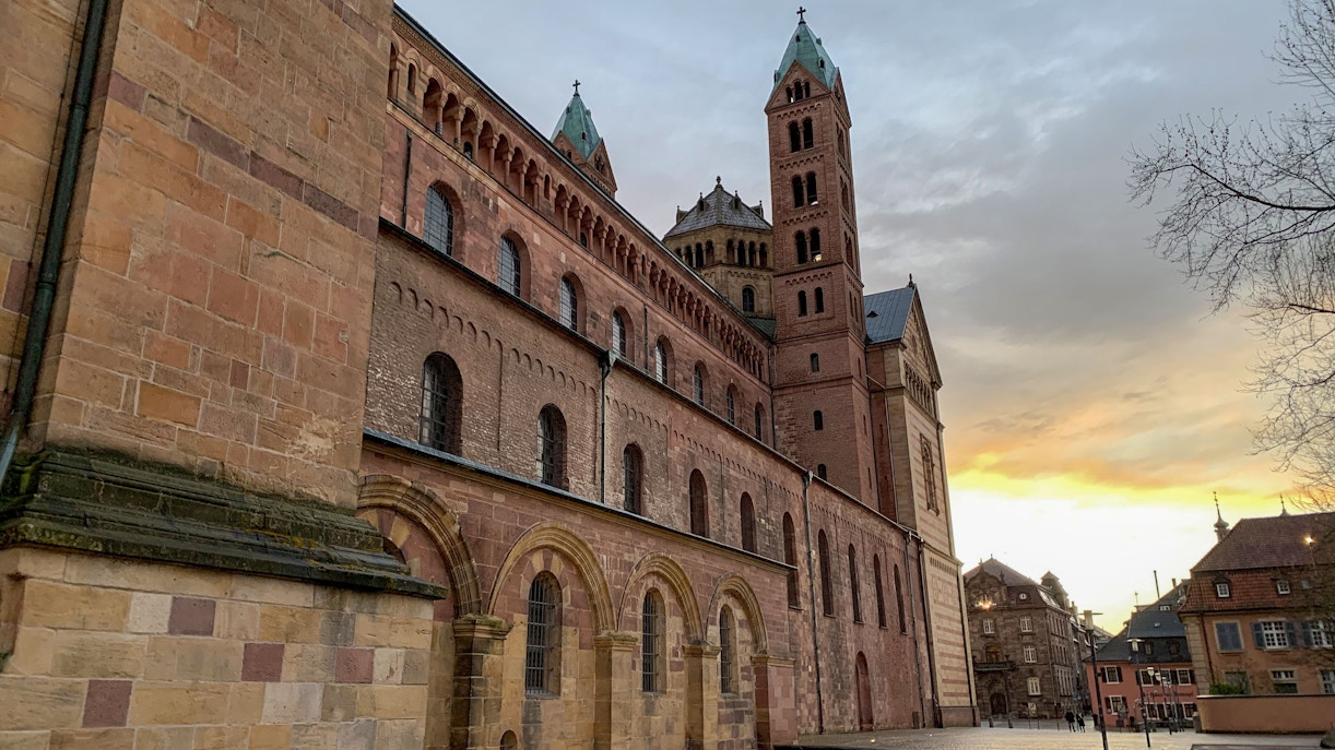St. Joseph Church in Augsburg with its ornate facade and twin spires against a clear sky.