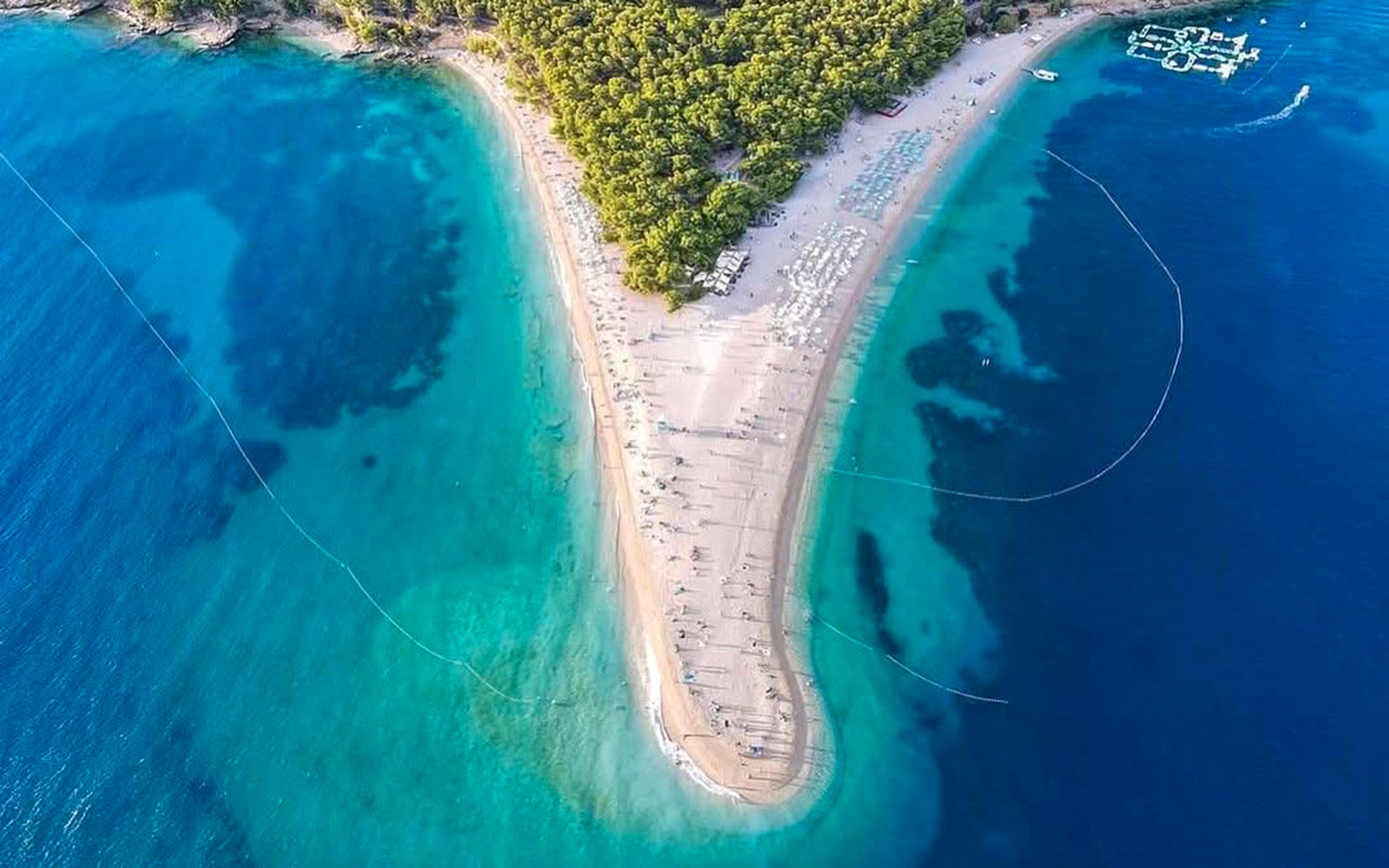 Aerial view of Zlatni Rat beach, Croatia, with turquoise waters and sandy shoreline.
