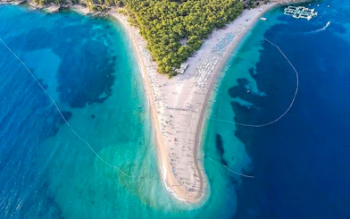 Aerial view of Zlatni Rat beach, Croatia, with turquoise waters and sandy shoreline.