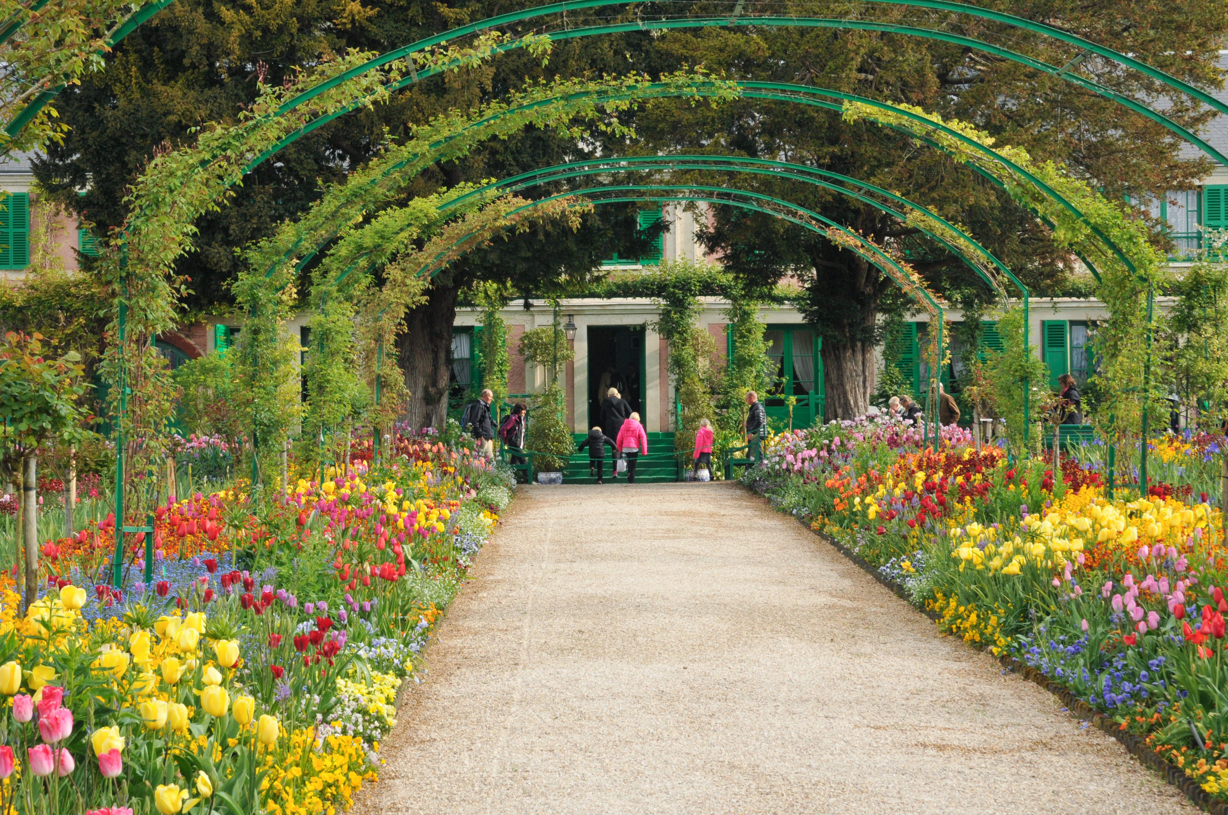 Giverny Gardens with vibrant flowers and lily pond in Normandy, France.