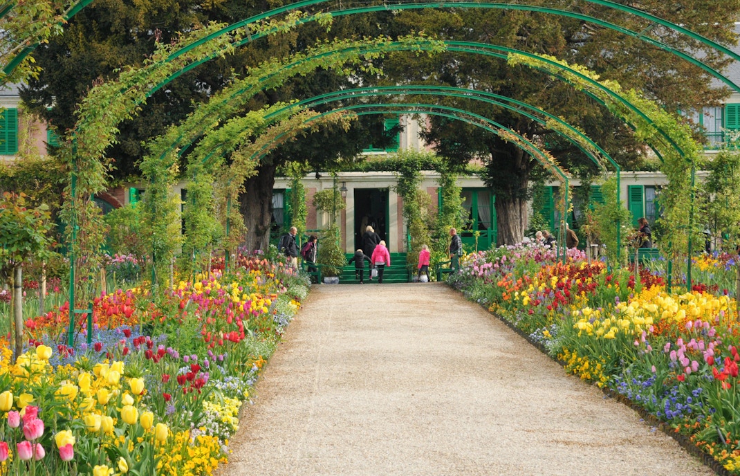 Giverny Gardens with vibrant flowers and lily pond in Normandy, France.