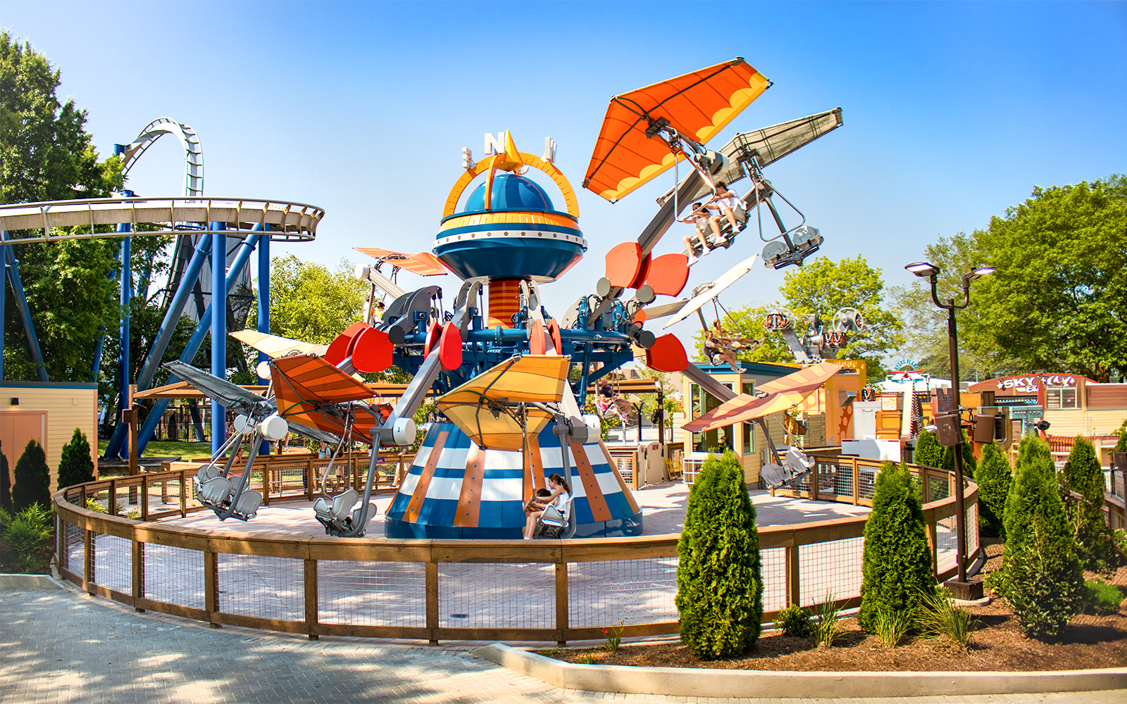 Wind Star ride at Six Flags Carowinds with colorful planes and riders in motion.