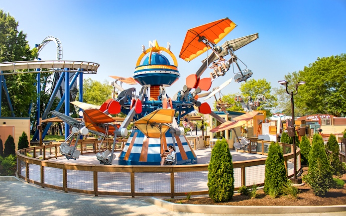 Wind Star ride at Six Flags Carowinds with colorful planes and riders in motion.