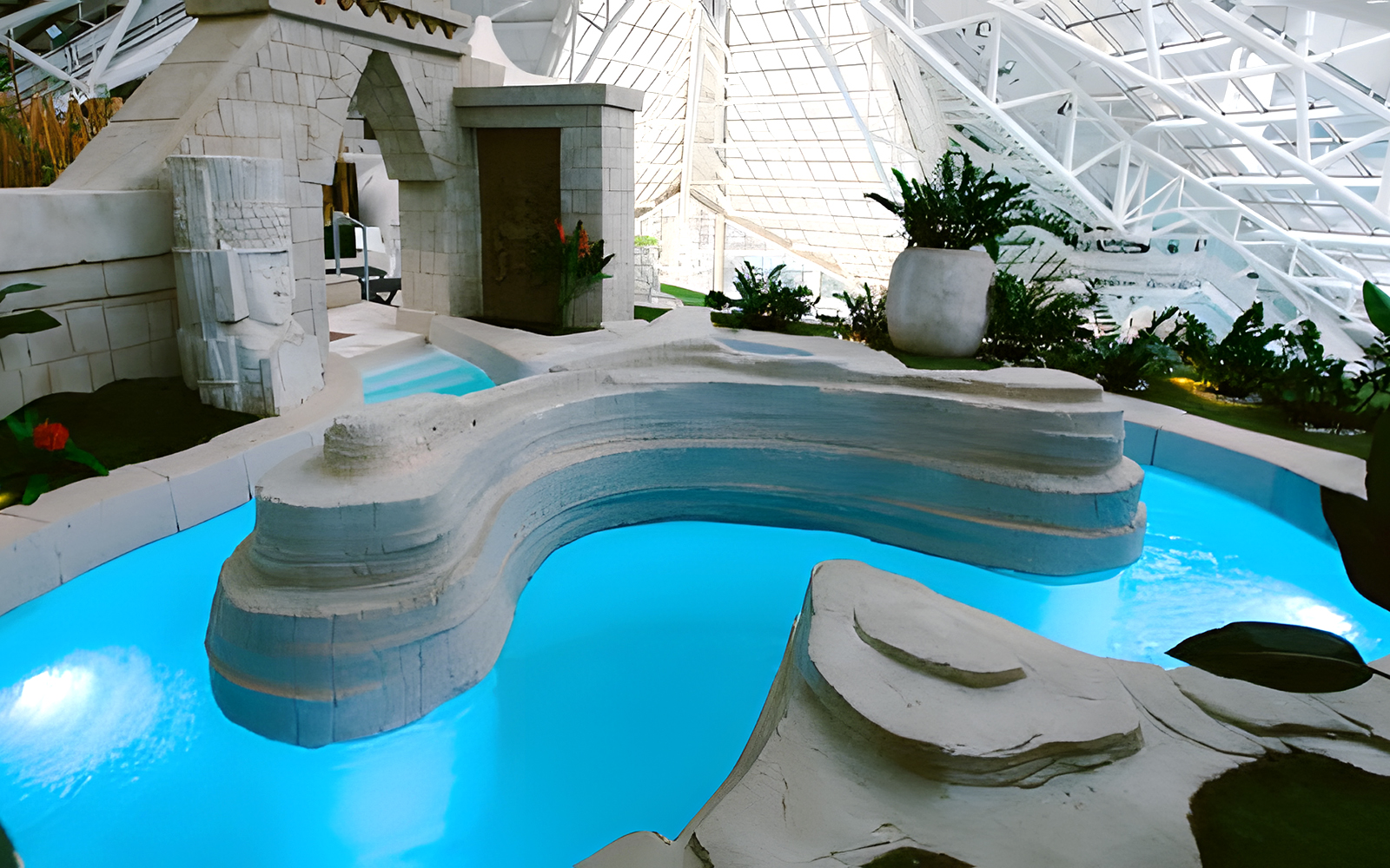 Aztec bath at Caldea Spa with intricate stone carvings in Andorra.