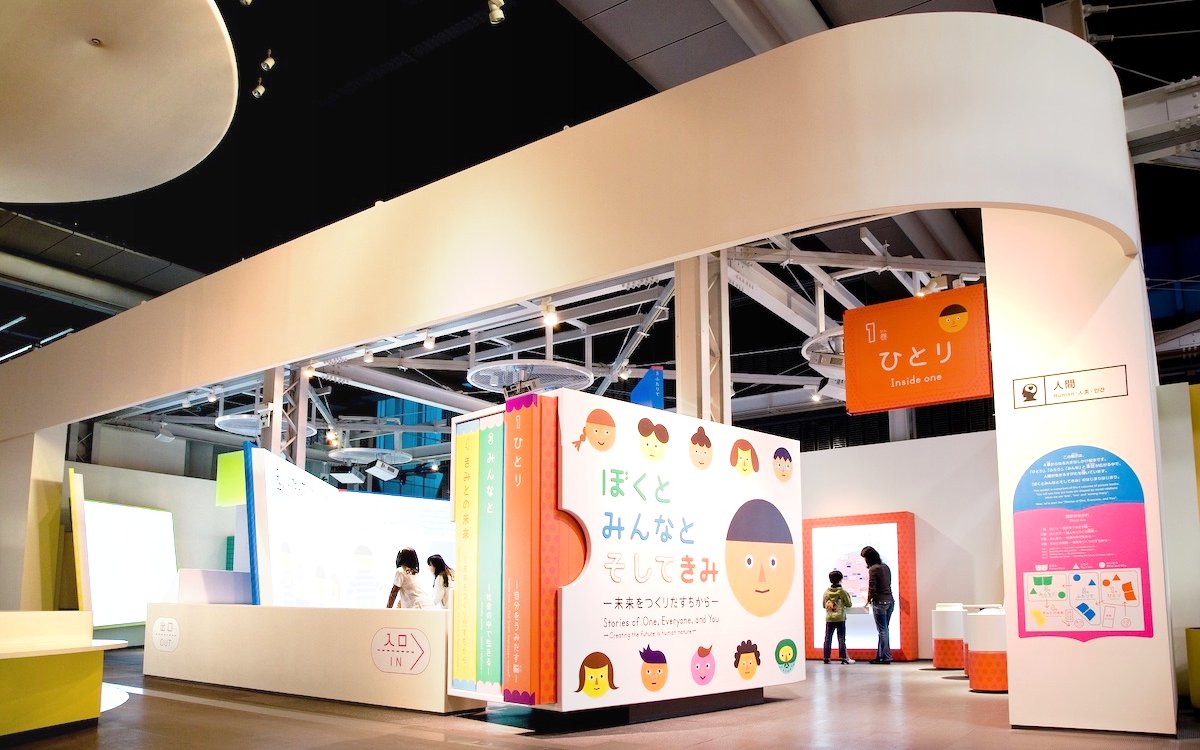 Miraikan permanent exhibition featuring interactive displays and colorful signage in Tokyo, Japan.