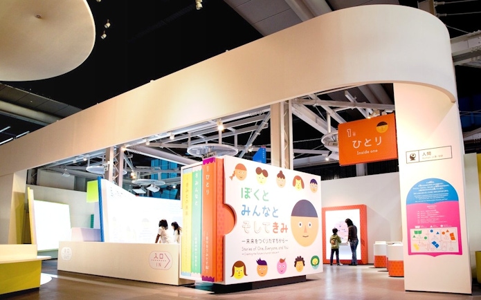 Miraikan permanent exhibition featuring interactive displays and colorful signage in Tokyo, Japan.