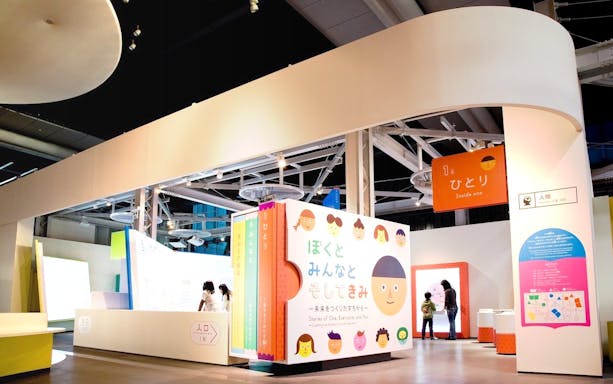 Miraikan permanent exhibition featuring interactive displays and colorful signage in Tokyo, Japan.