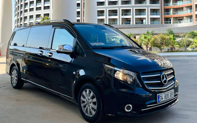 Private transfer van parked outside a hotel in Antalya, Turkey.
