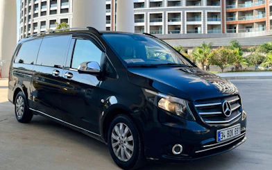 Private transfer van parked outside a hotel in Antalya, Turkey.
