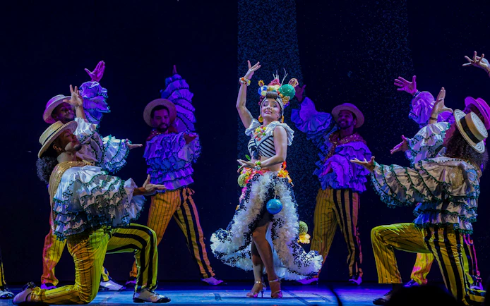 Performers in colorful costumes dancing at the Roxy Dinner Show, Rio de Janeiro.