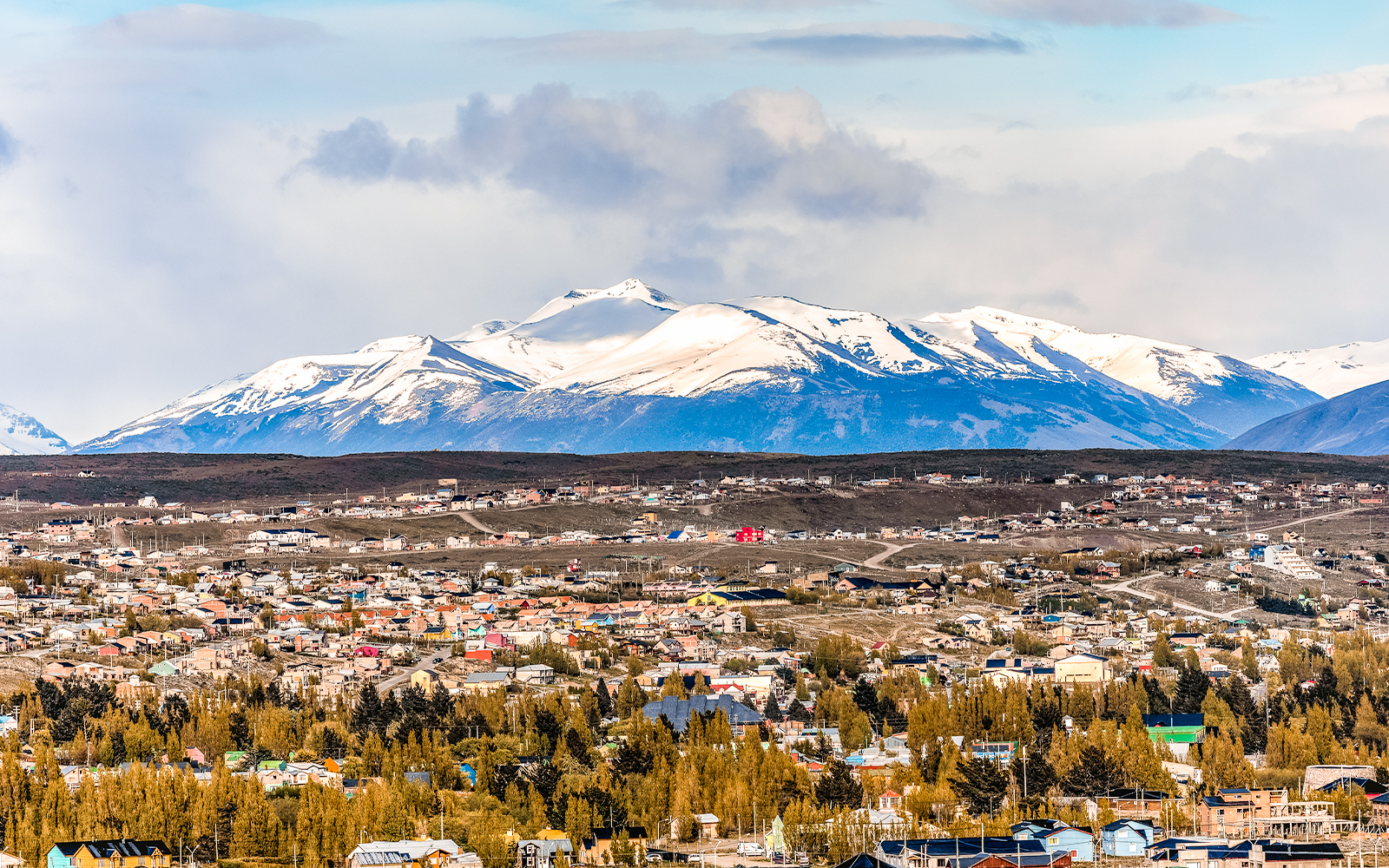 Aerial view of El Chaltén with Mount Fitz Roy in the background.