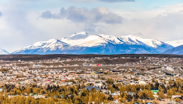 Aerial view of El Chaltén with Mount Fitz Roy in the background.
