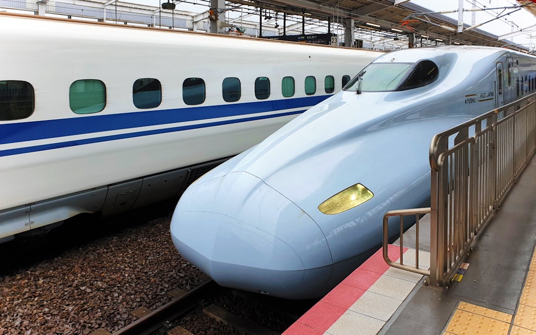 Japanese bullet train on a platform in Japan.