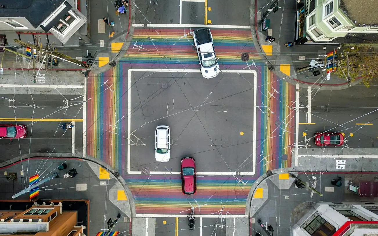 Aerial view of rainbow crosswalks at Castro District intersection, San Francisco.