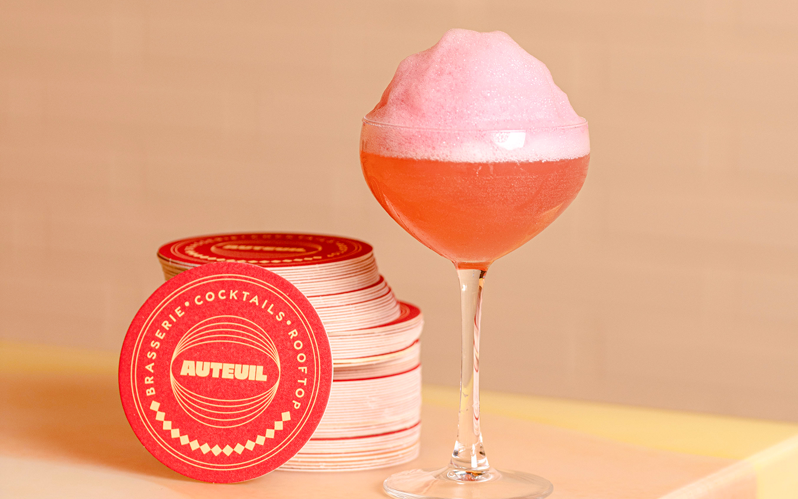 Cocktail with pink foam at Brasserie Auteuil, Paris.