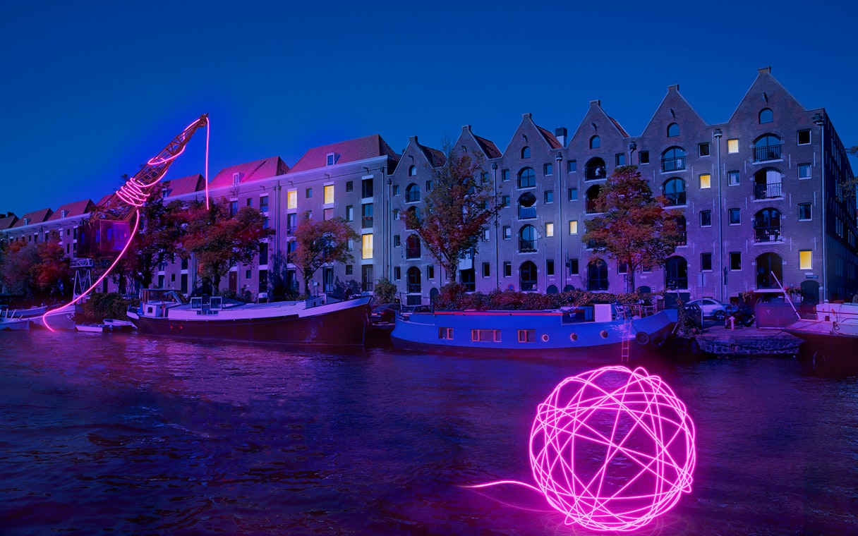 Amsterdam Light Festival installation along canal during Blue Boat Company evening cruise.