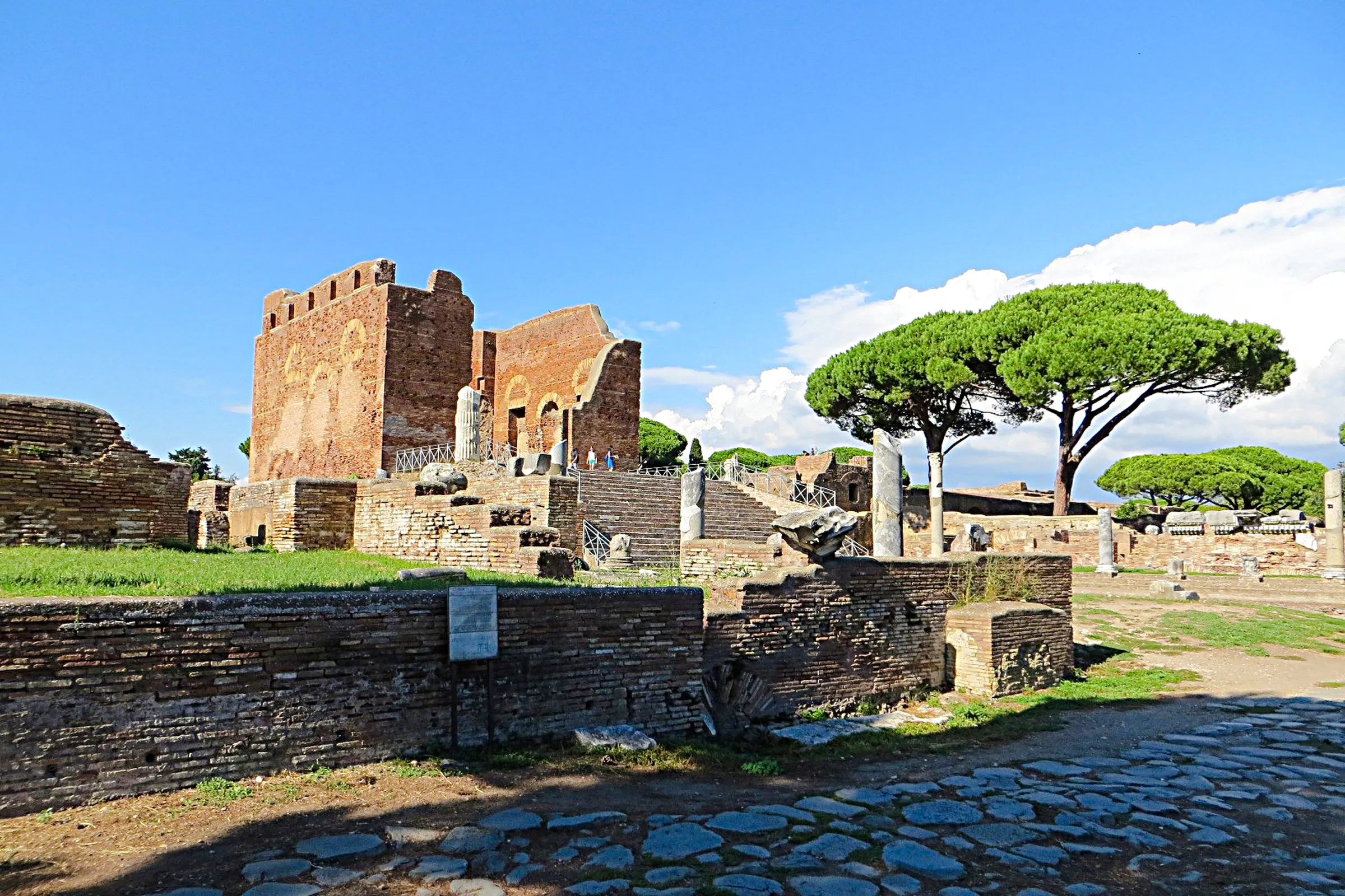 Ostia Antica ruins with ancient brick structures and stone columns, Rome.