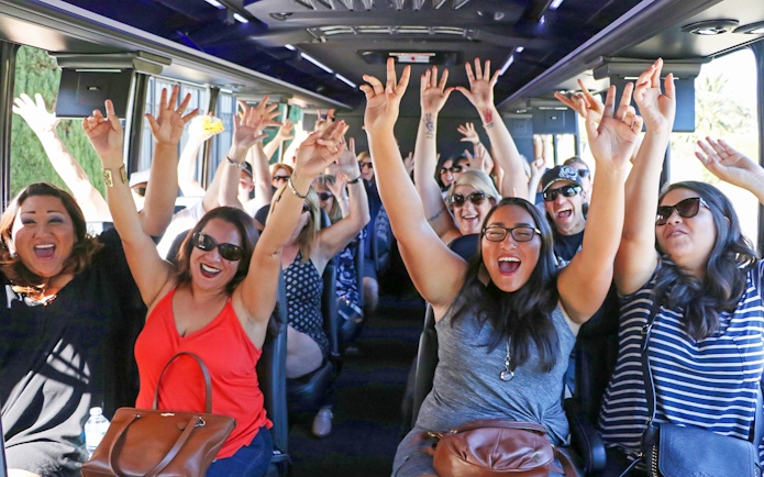 Tourists enjoying the TMZ Hollywood Tour bus experience.