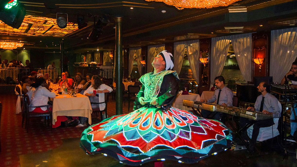 Dancer performing on a luxury Nile dinner cruise with live music.