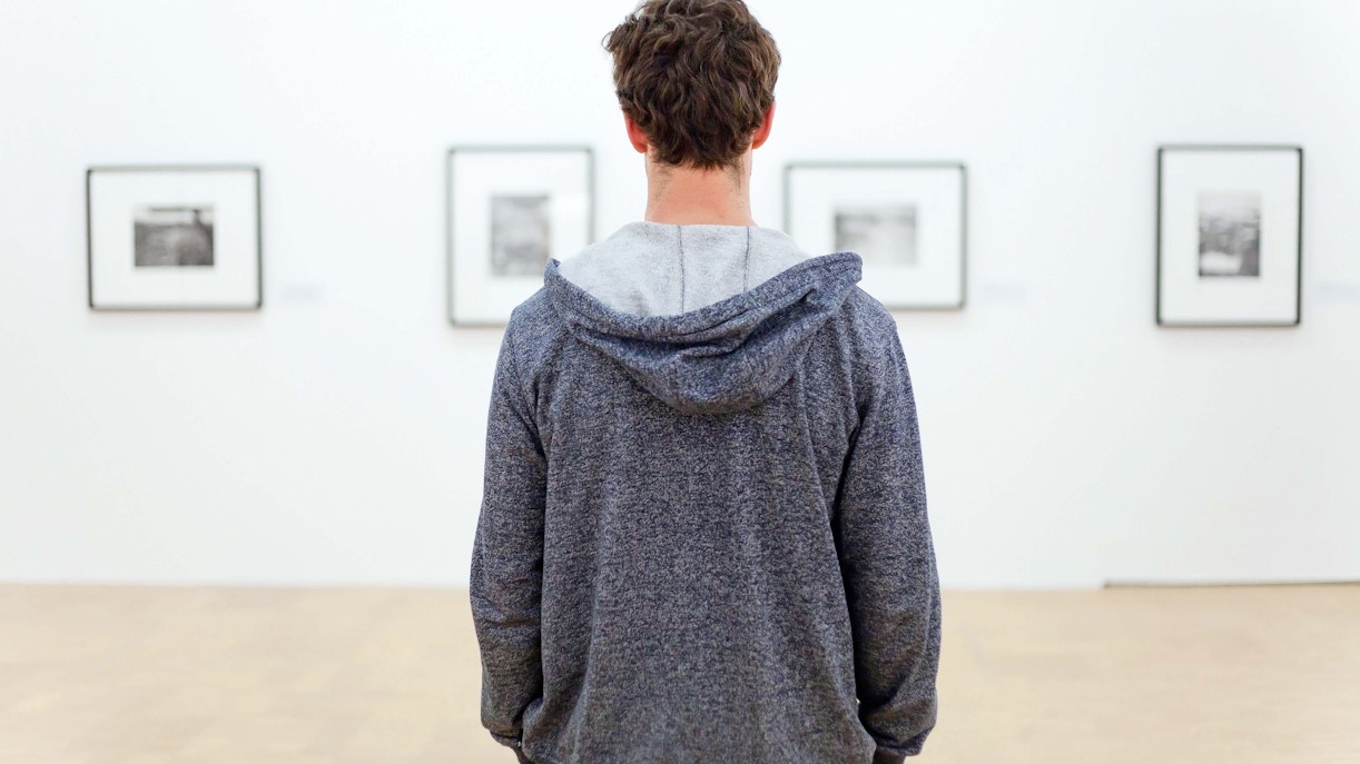 Visitors viewing modern art exhibits at MoMA, New York City.